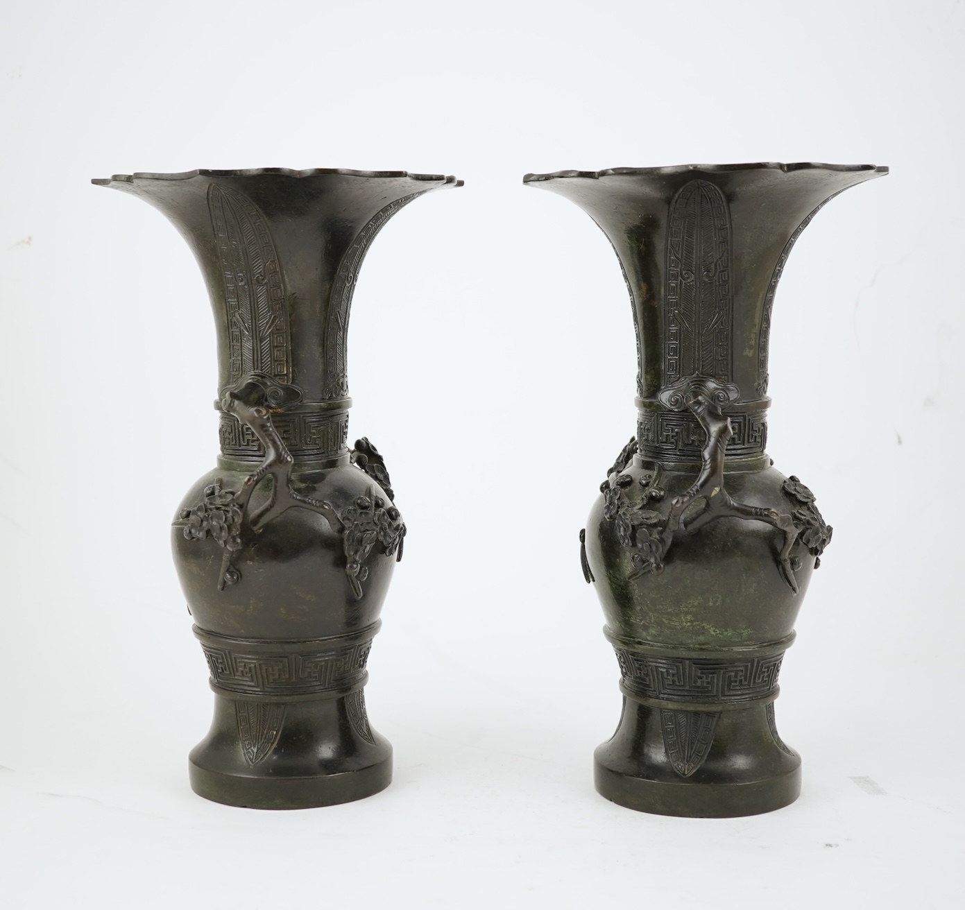 A pair of Chinese bronze gu-shaped vases, Qing dynasty